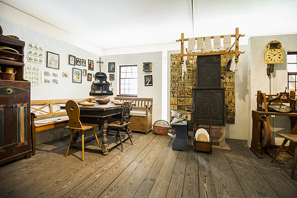 A living room and objects of the domestic clock making industry