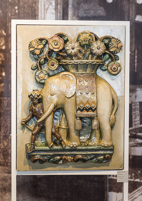 Tile with an elephant carrying a basket